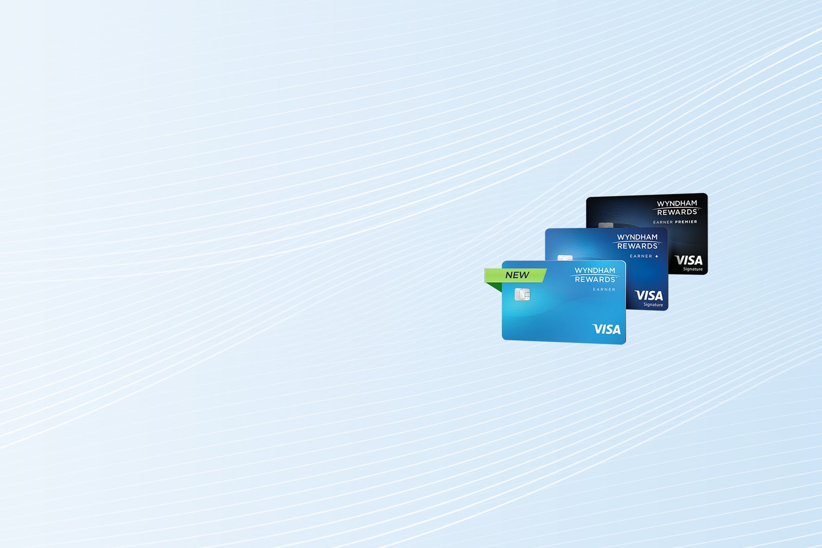 Three Wyndham Rewards Earner Cards stacked in an angle against a light blue pattern background.