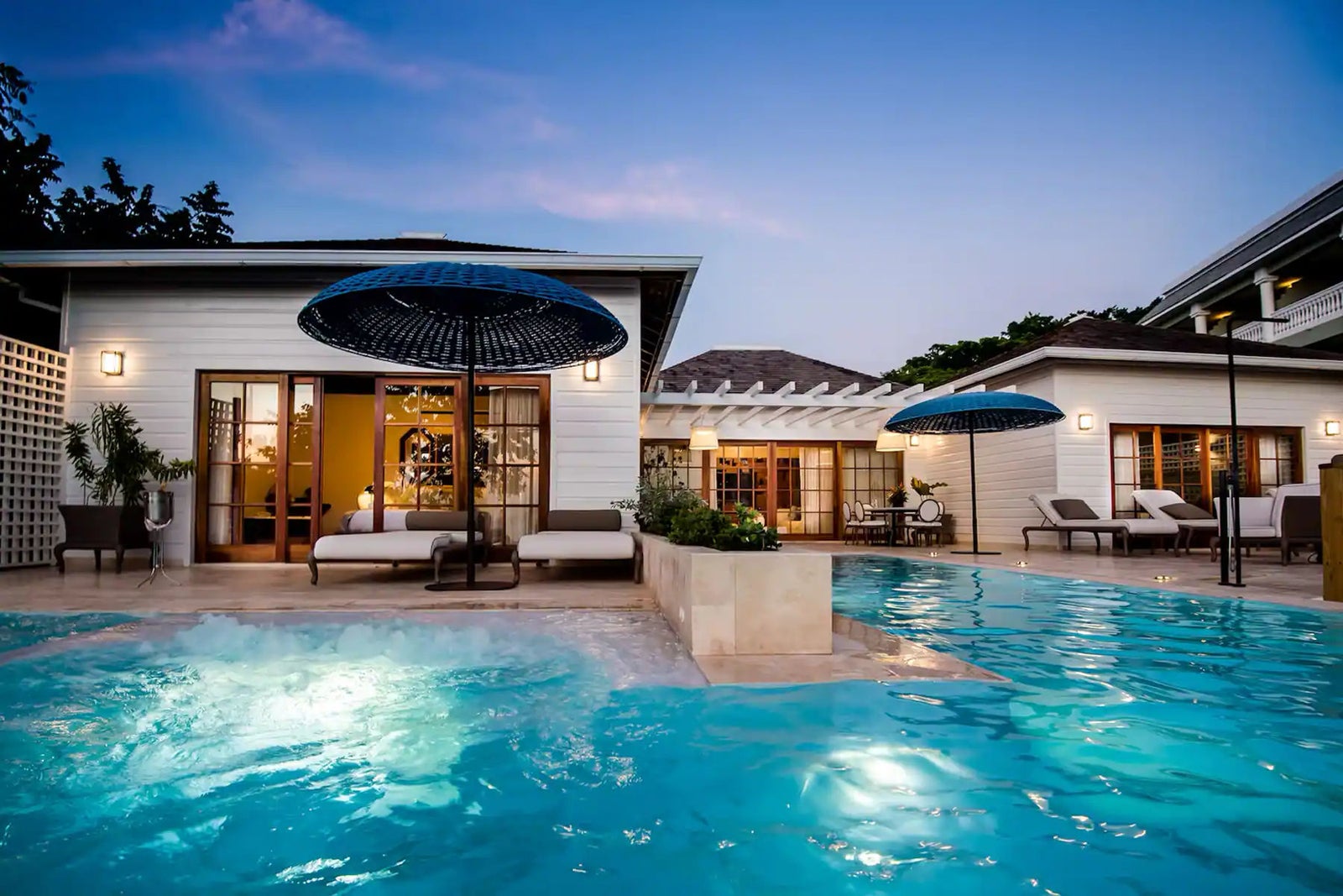 Pool outside of a hotel guestroom.