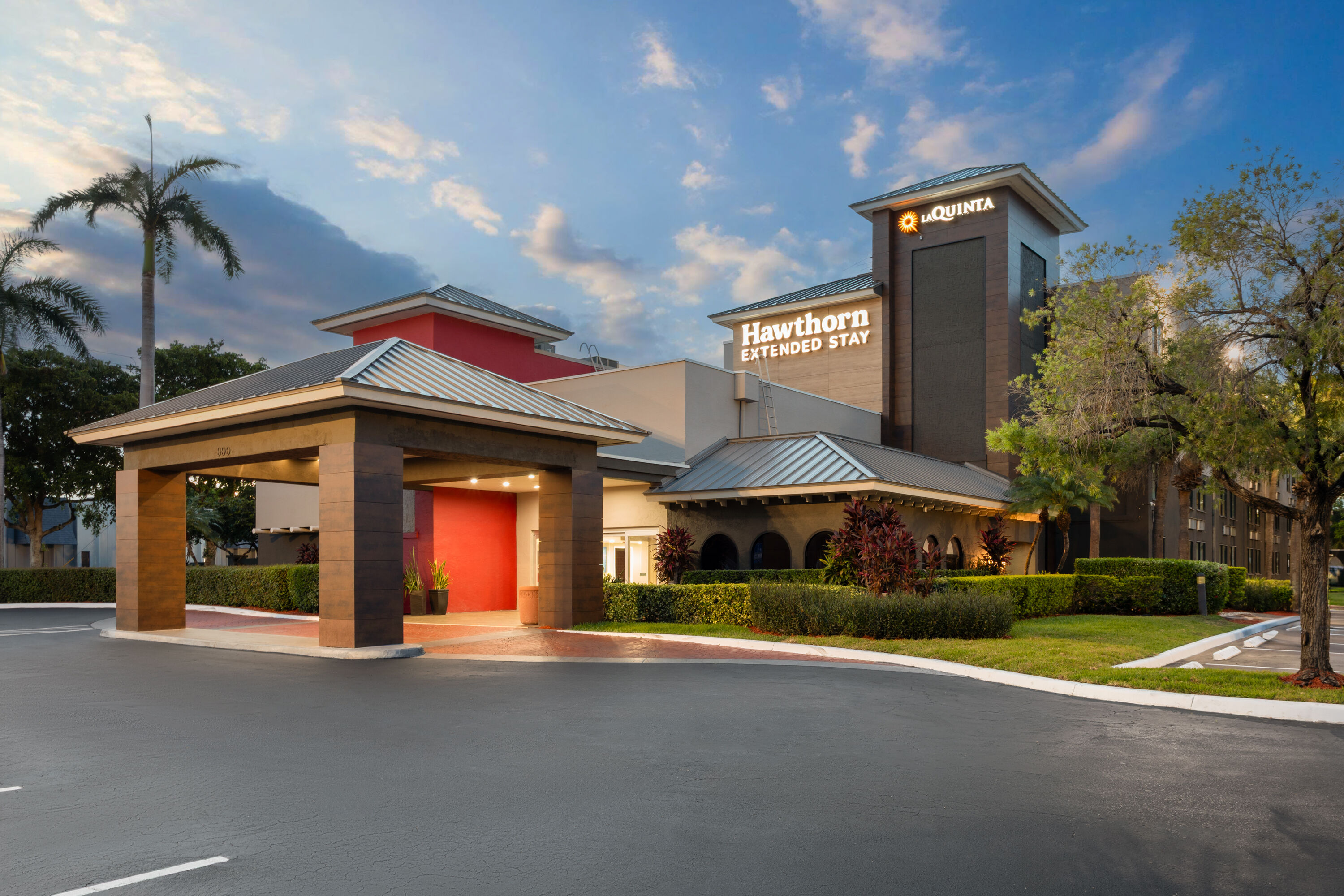 Exterior Dusk Image of Hawthorn Extended Stay by Wyndham Ft Lauderdale Cypress Crk hotel in Fort Lauderdale, Florida