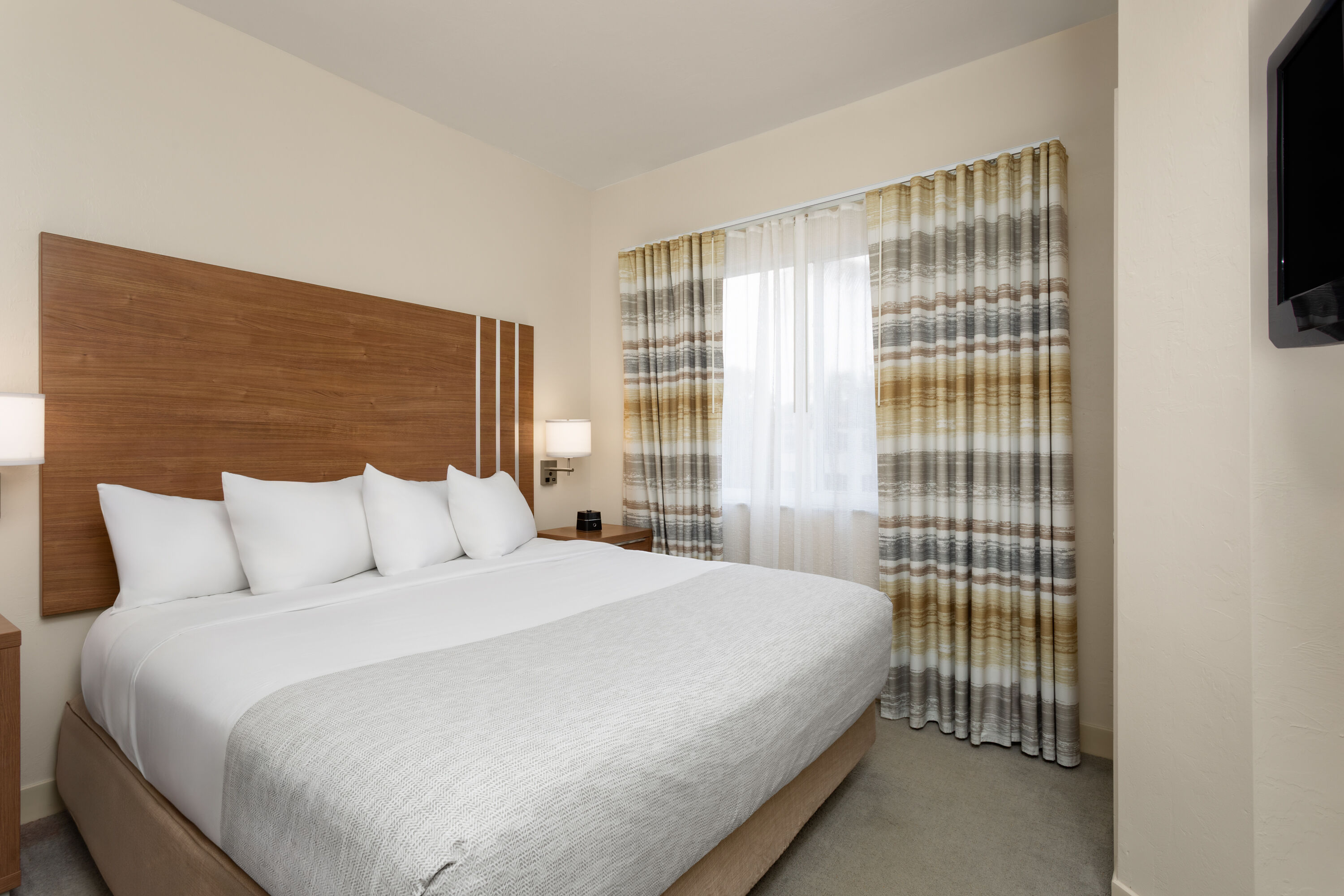 Guest room at the Hawthorn Extended Stay by Wyndham Naples in Naples, Florida