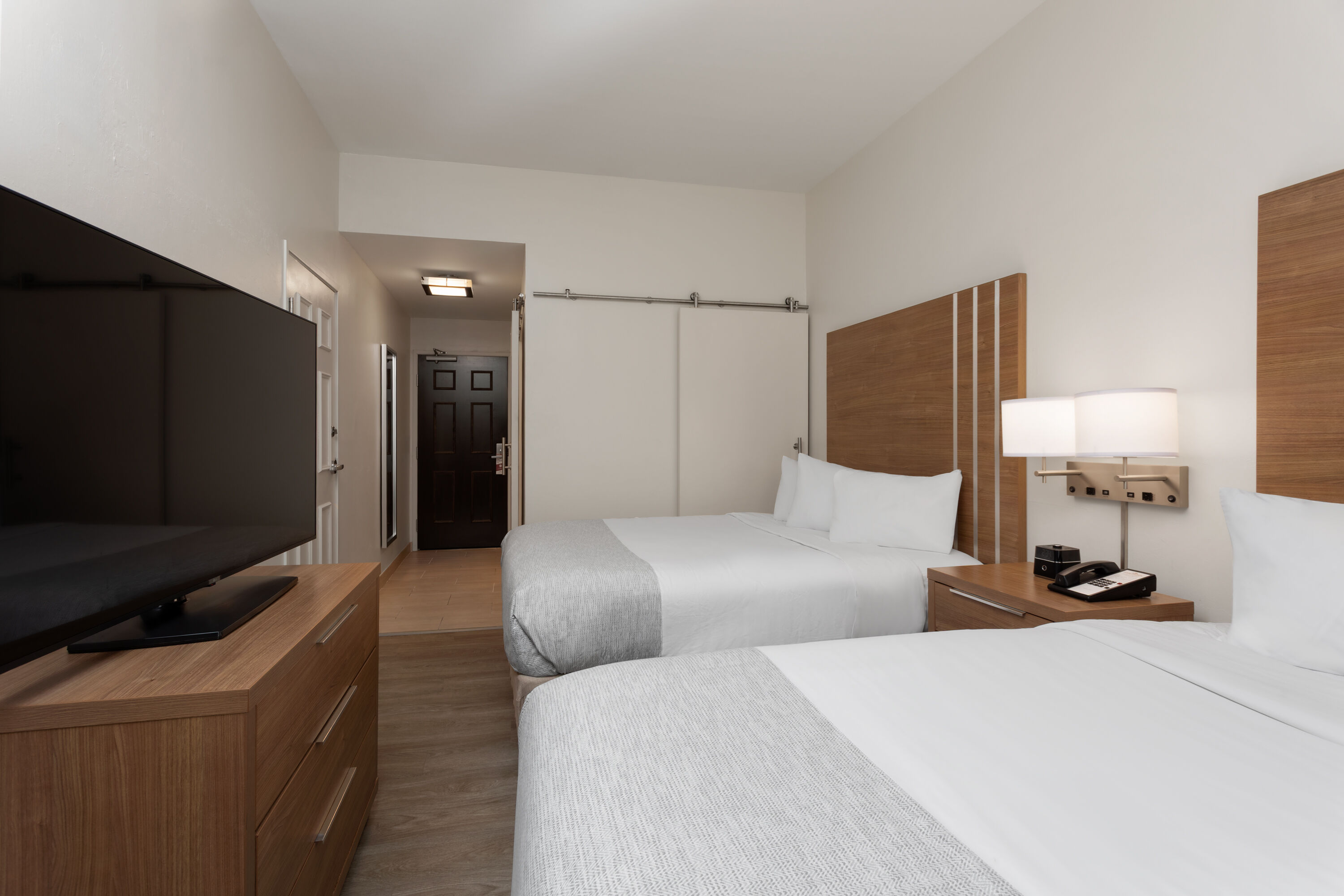 Guest room at the Hawthorn Extended Stay by Wyndham Naples in Naples, Florida