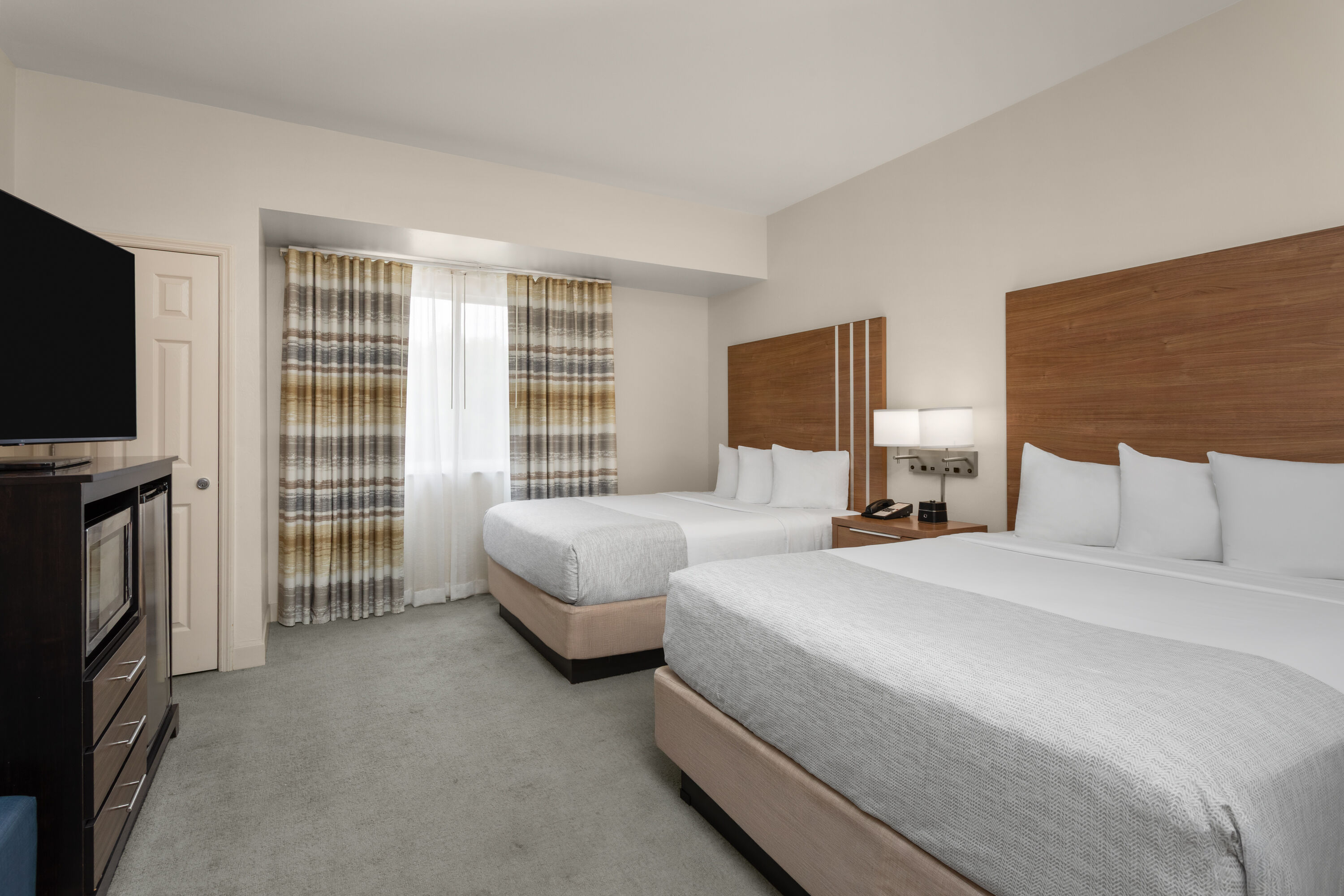 Guest room at the Hawthorn Extended Stay by Wyndham Naples in Naples, Florida