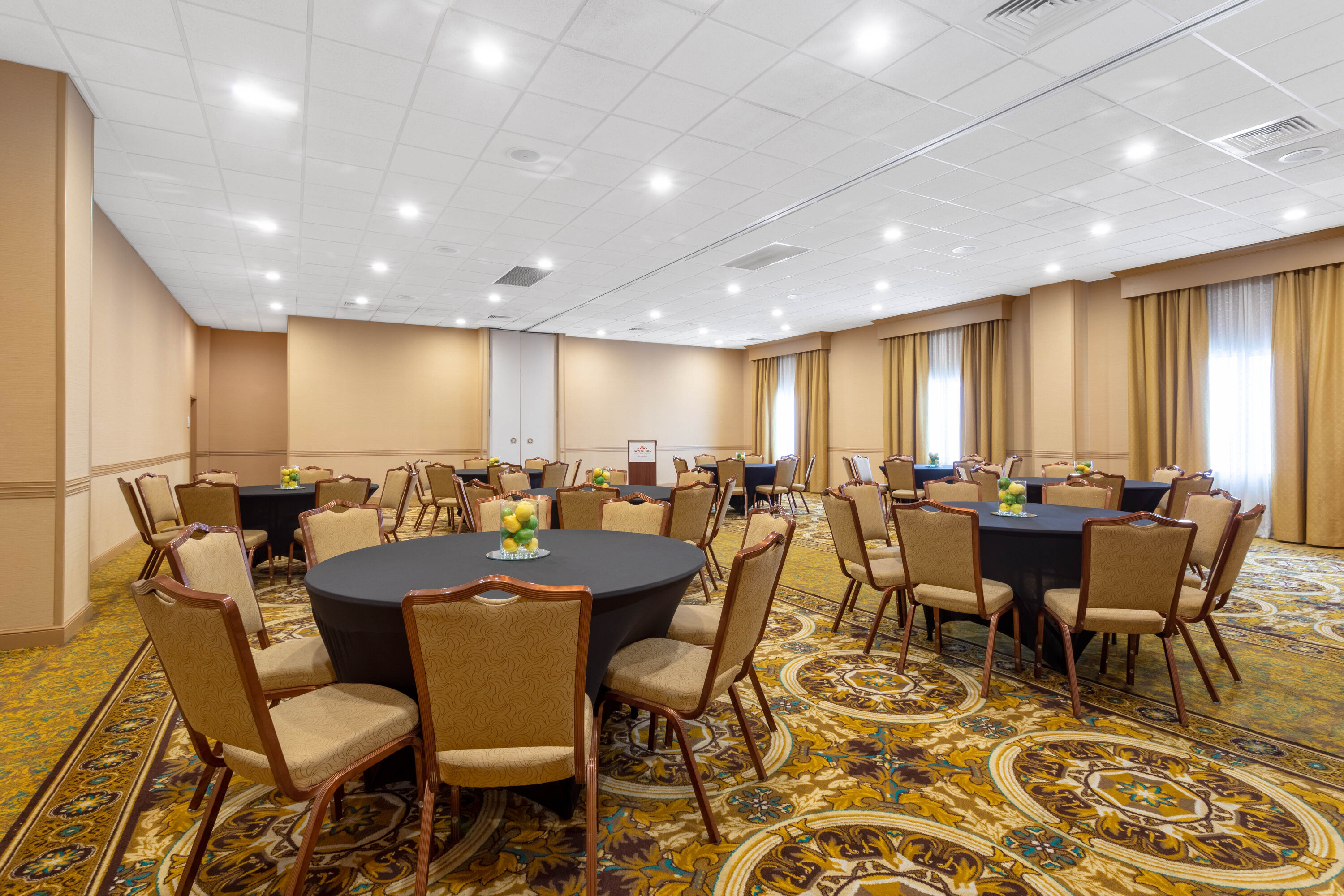 Meeting room banquet rounds at Hawthorn Extended Stay by Wyndham West Palm Beach Airport in West Palm Beach, Florida