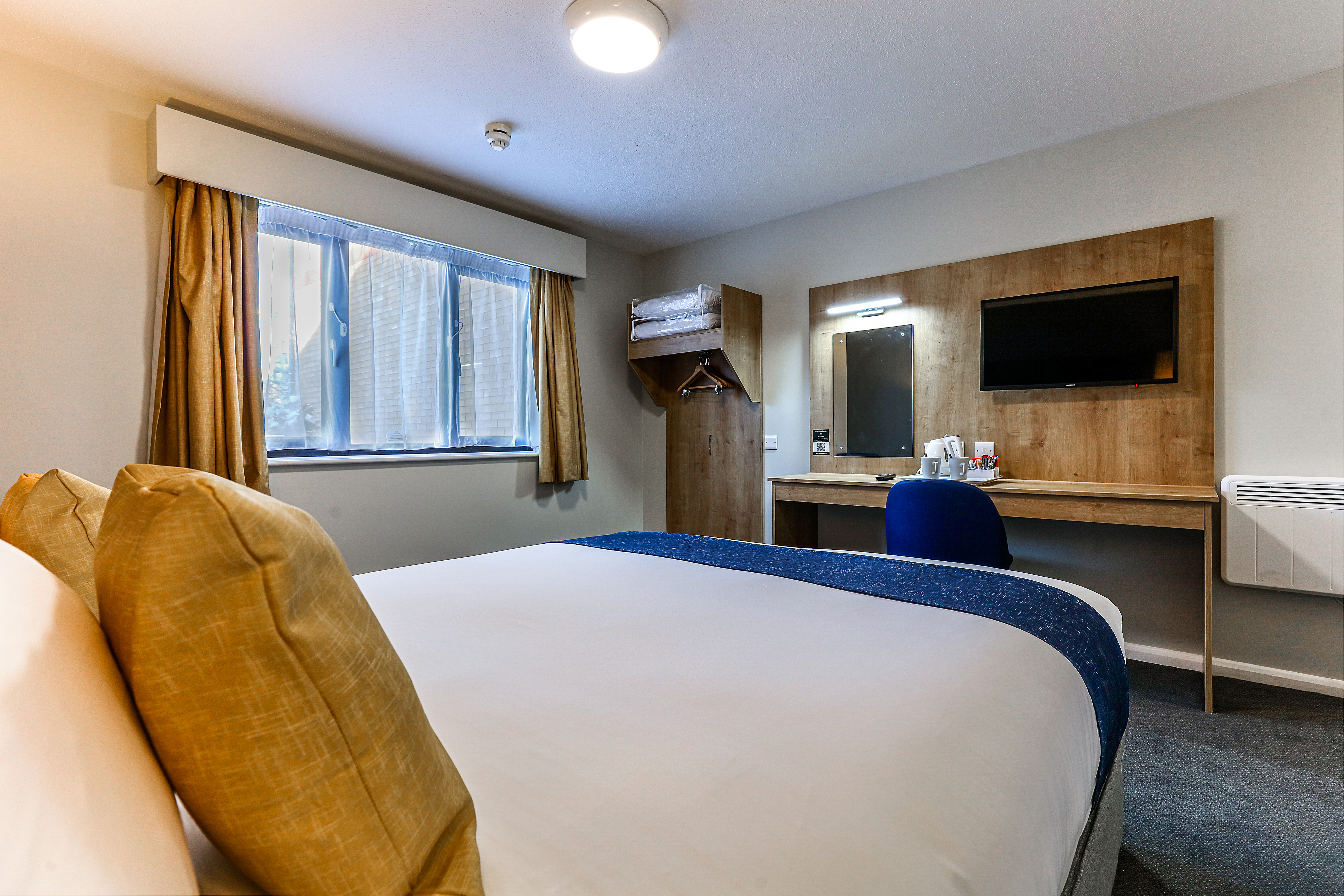 Guest room at the Days Inn by Wyndham London Stansted Airport in Bishops Stortford, Other than US/Canada