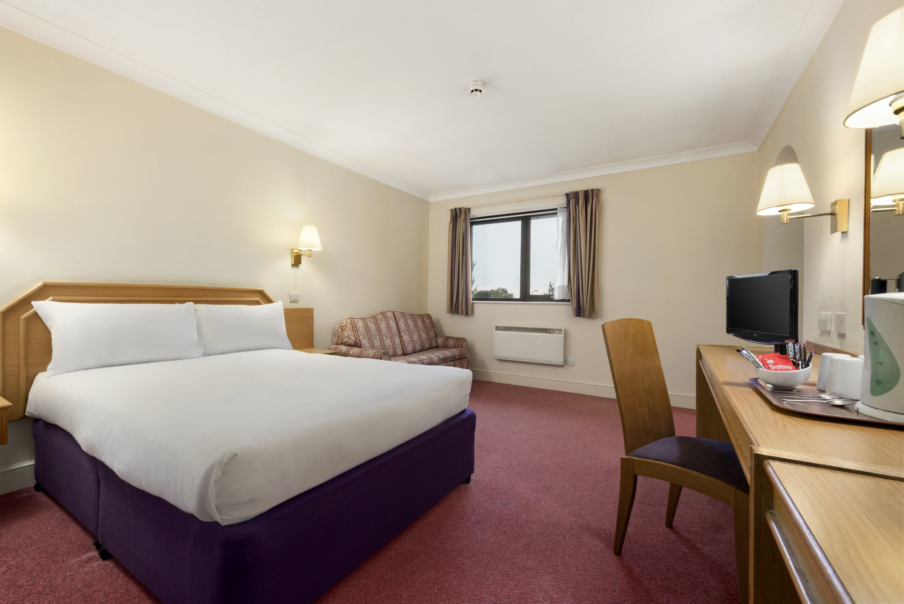 Guest room at the Days Inn by Wyndham Stafford in Stone, Other than US/Canada