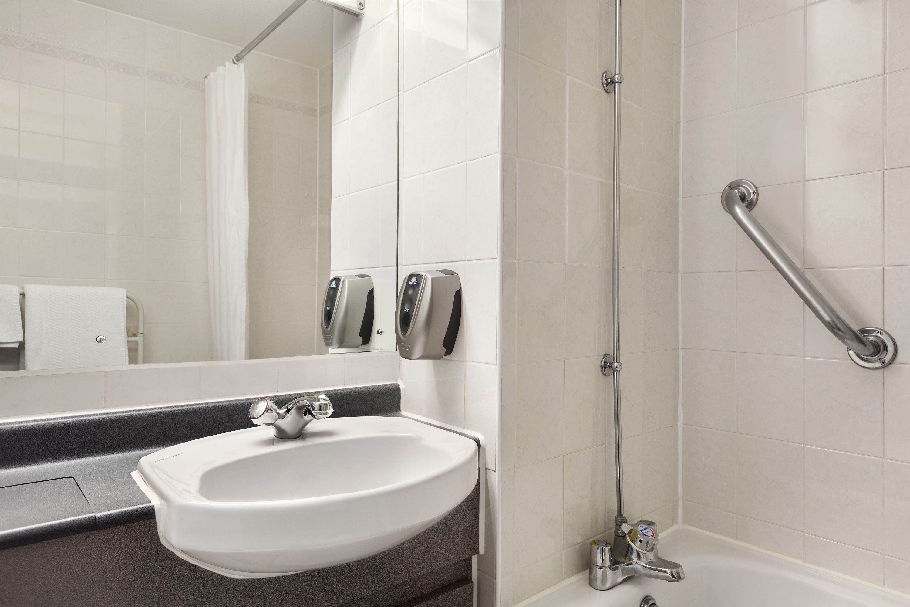 Guest room bath at the Days Inn by Wyndham Sevenoaks Clacket Lane in Westerham, Other than US/Canada