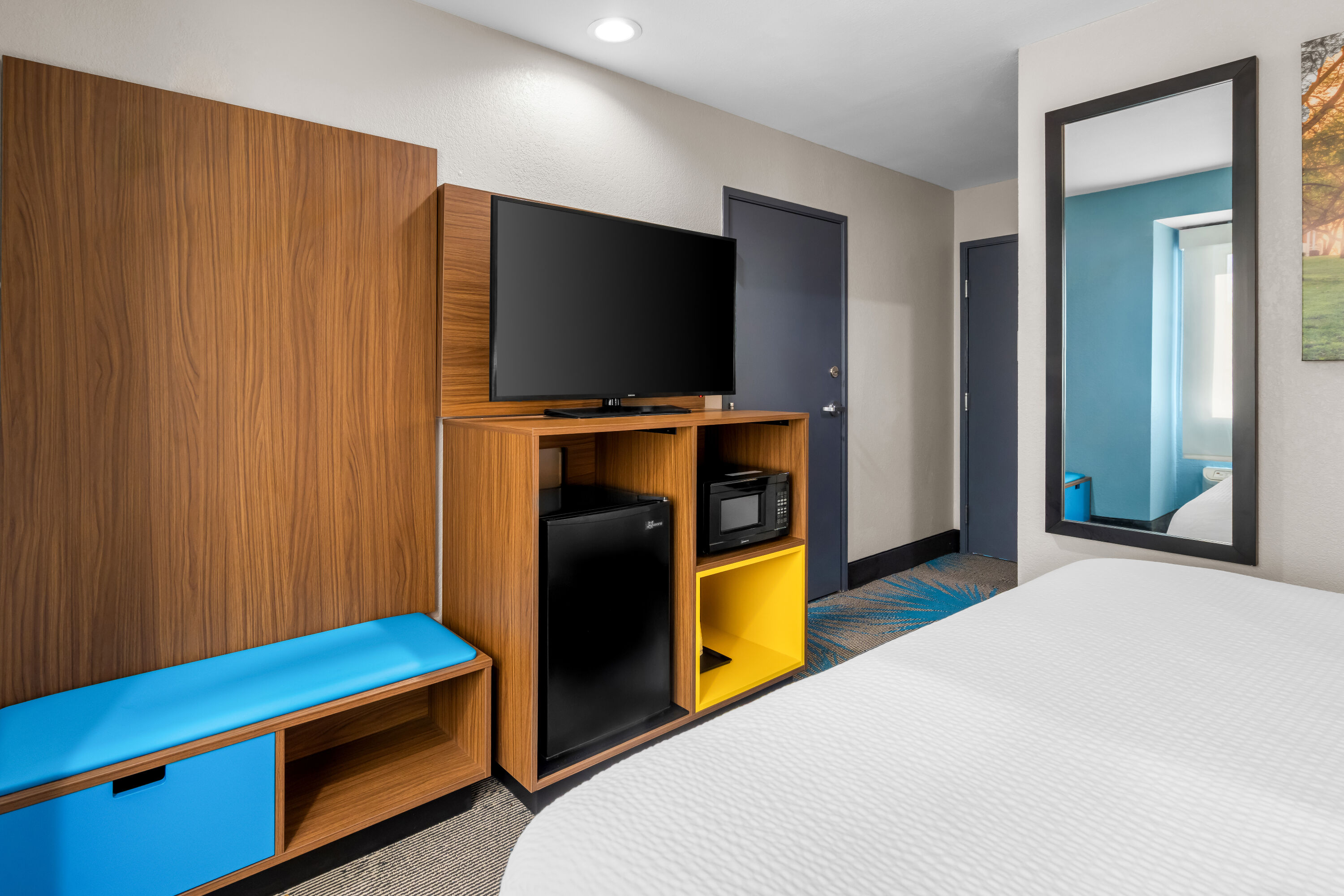 King bed guest room at the Days Inn & Suites by Wyndham Brandon Amphitheater in Brandon, Mississippi