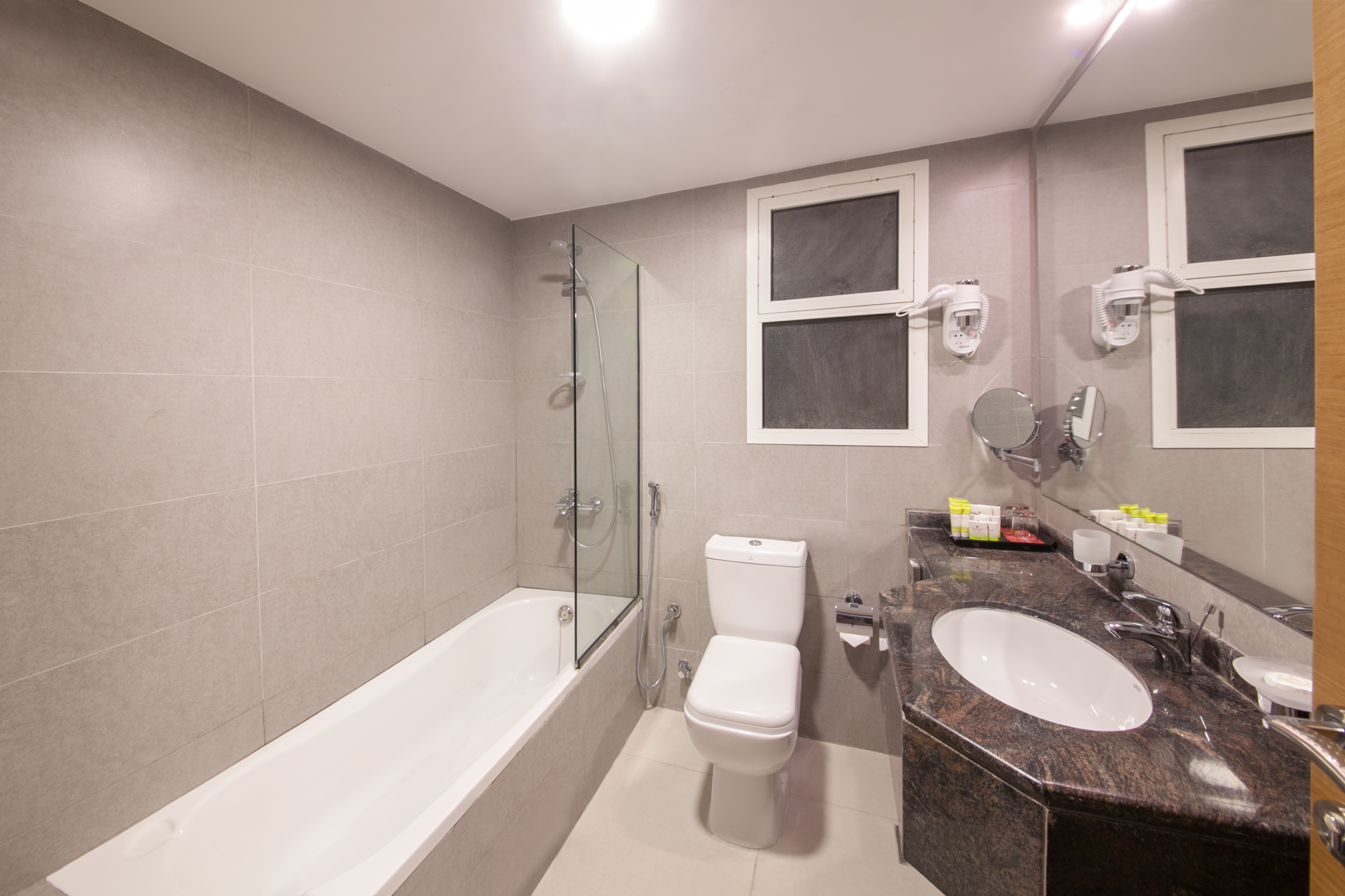 Guest room bath at the Ramada by Wyndham Beach Hotel Ajman in Ajman, Other than US/Canada