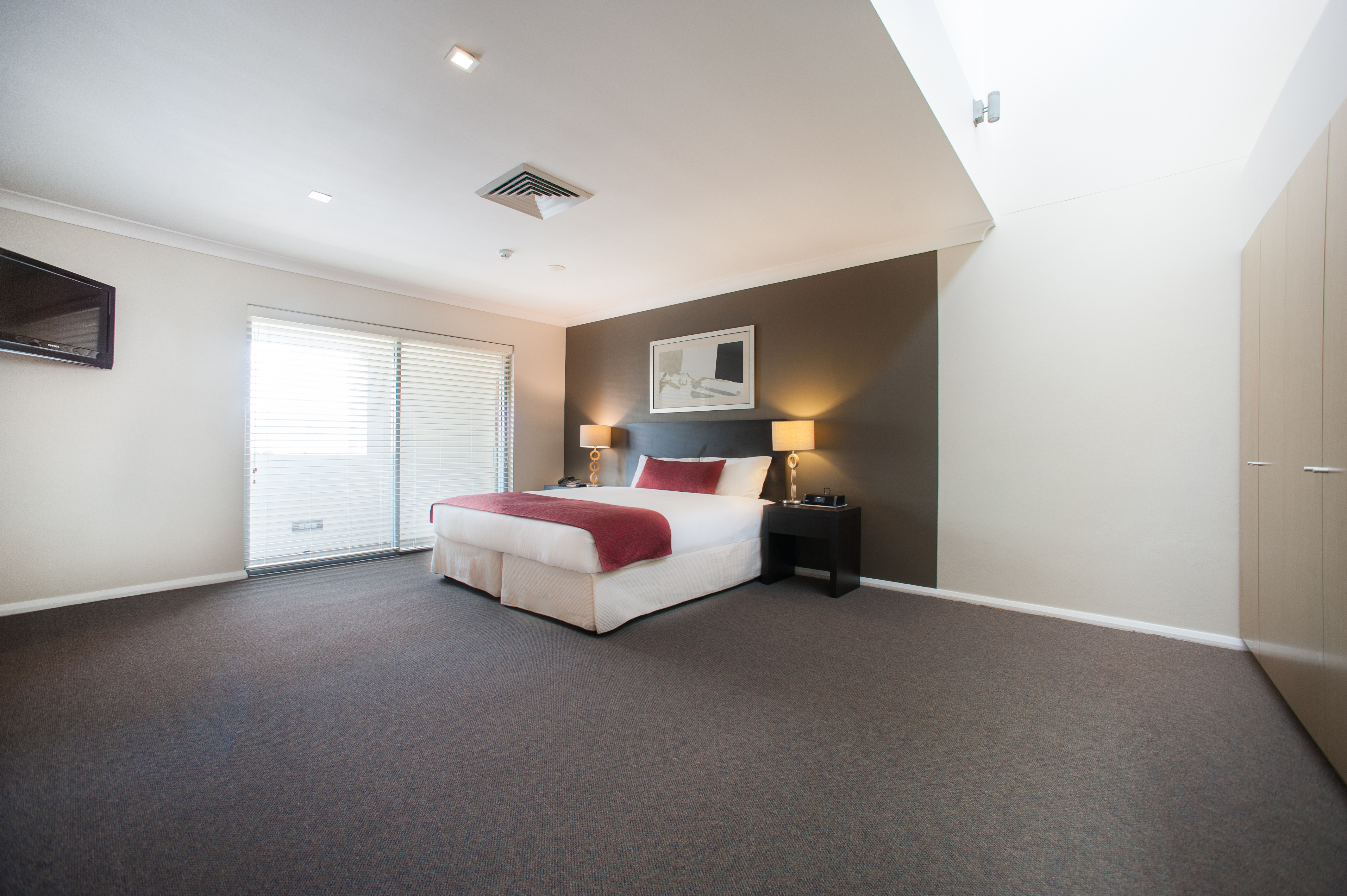 Guest room at the Ramada Hotel & Suites by Wyndham Sydney Cabramatta in Cabramatta, Other than US/Canada