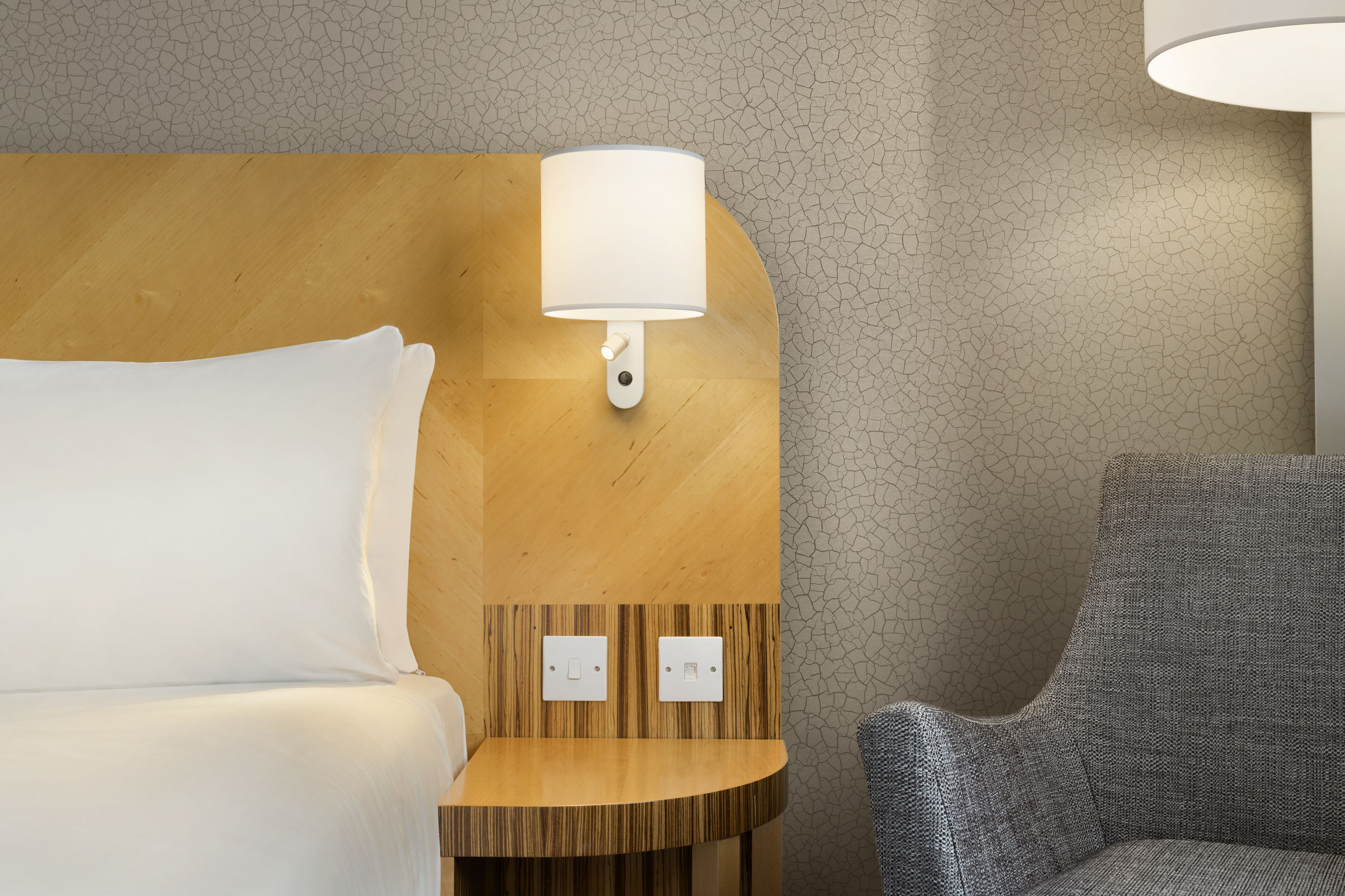 Guest room at the Ramada Hotel & Suites by Wyndham Coventry in Coventry, Other than US/Canada