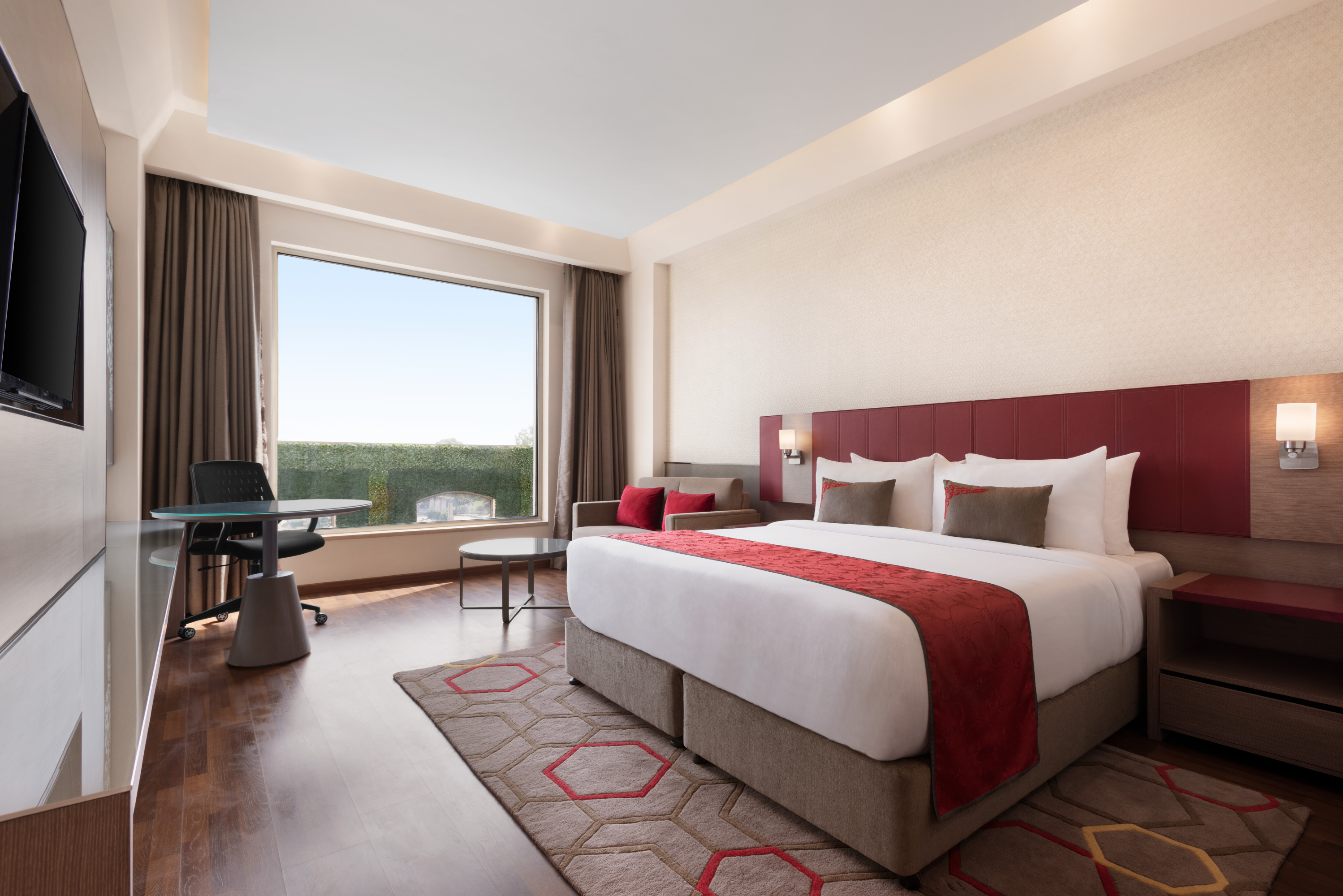 Guest room at the Ramada Plaza by Wyndham Lucknow in Lucknow, Other than US/Canada