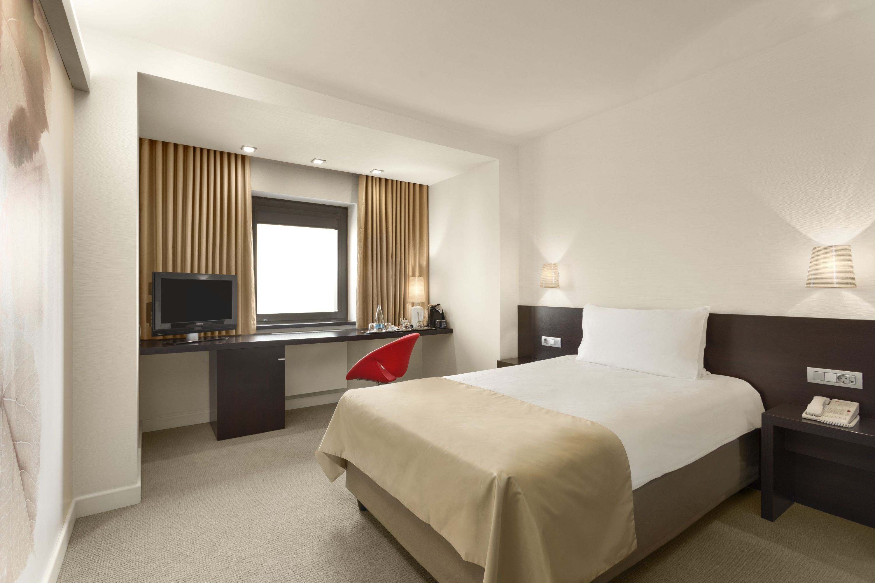 Guest room at the Ramada Plaza by Wyndham Bucharest Convention Center in Bucharest, Other than US/Canada