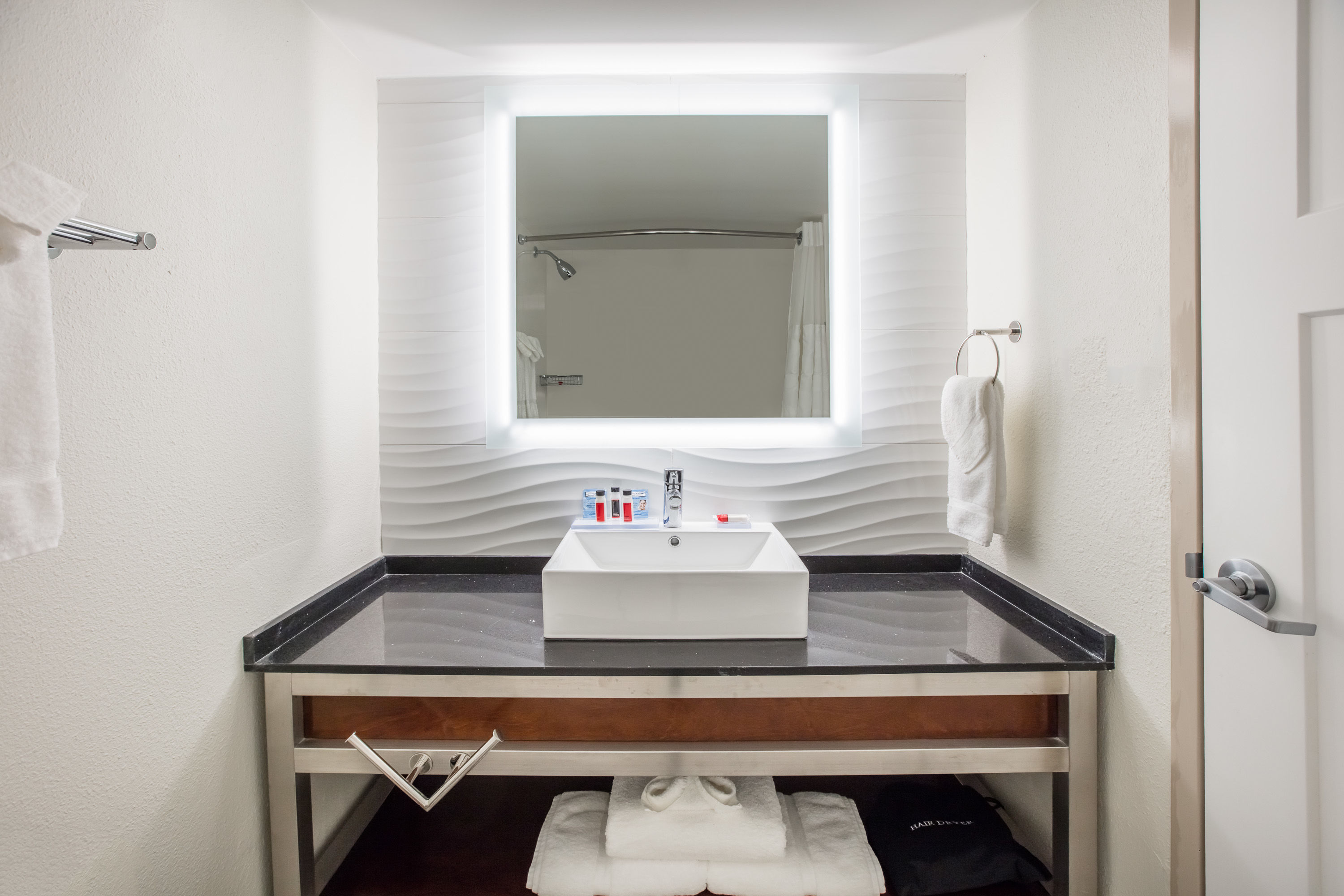 Guest room bath at the Ramada by Wyndham Austin South in Austin, Texas