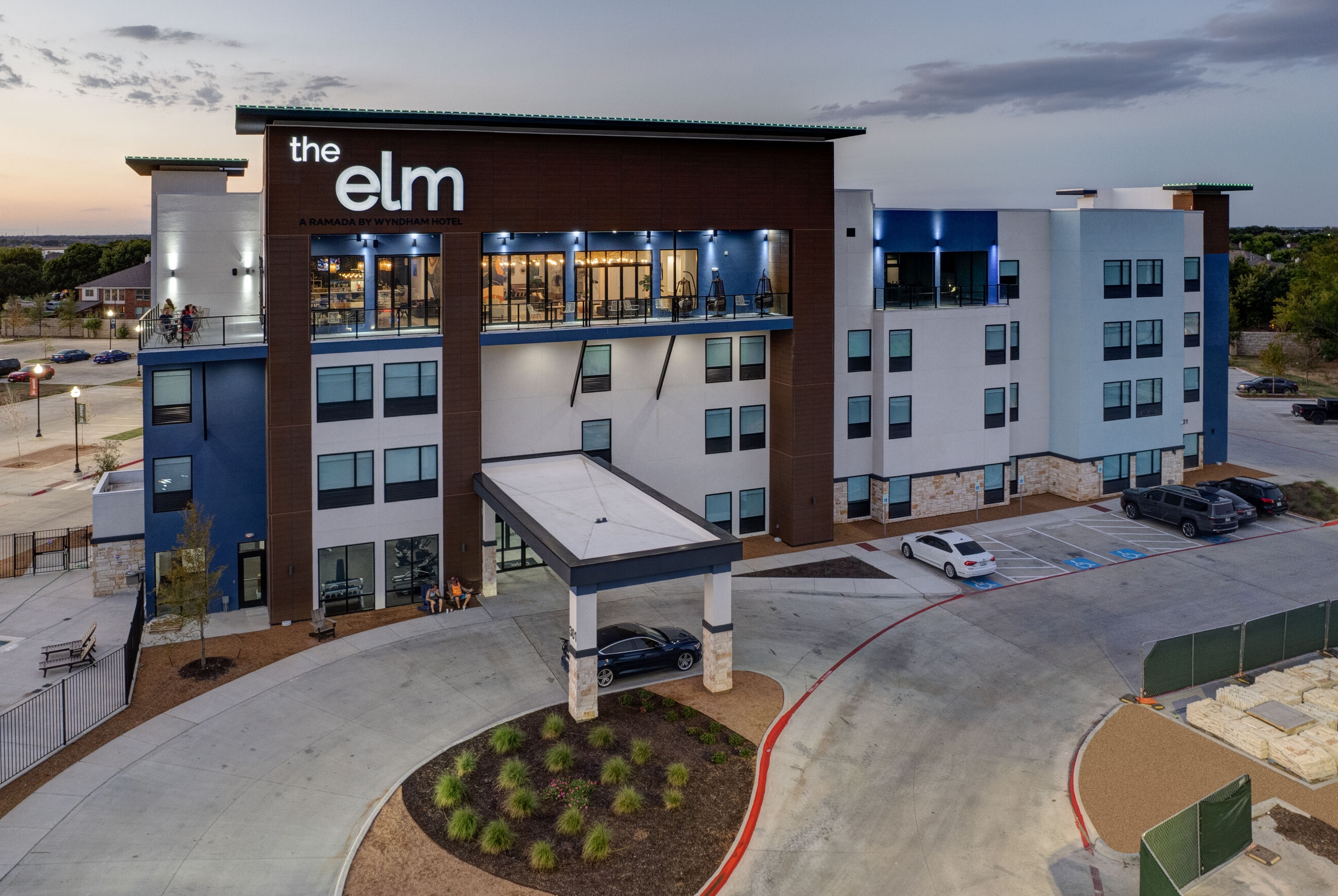 Exterior Dusk Image of The Elm, a Ramada by Wyndham hotel in Little Elm, Texas